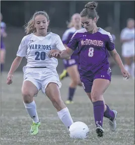  ?? PHOTO BY WALLACE BARRON ?? McDonough’s Kaylyn Rivera, right, dribbles up field as she is defended by La Plata’s Kristen Ging in Tuesday’s SMAC Potomac Division girls soccer contest. Ging assisted on the Mia Parr’s game-winner with less than three minutes remaining in regulation,...