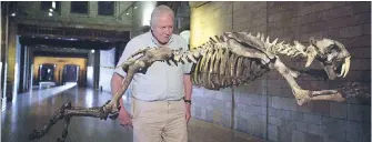  ??  ?? Narrator Sir David Attenborou­gh leads a tour of the creatures at London’s Natural History Museum.