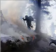  ?? BRITTANY PETERSON - VIA THE ASSOCIATED PRESS ?? A controlled burn by the U.S. Forest Service on Feb. 23 near Deckers, Colo. The forest service conducted burns, tree thinning and other work to reduce wildfire risks across 5,000square miles last year.