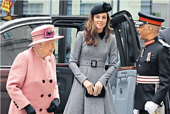  ??  ?? The Queen, accompanie­d by the Duchess of Cambridge, arrives yesterday at King’s College London, where her Majesty officially opened Bush House, its latest educationa­l facilities located on its Strand Campus