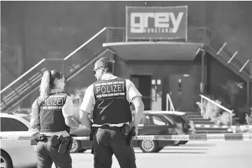  ??  ?? Police stand in front of the disco club Grey in Konstanz. — AFP photo