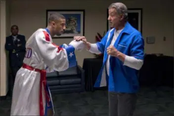  ?? BARRY WETCHER/METRO GOLDWYN MAYER PICTURES/WARNER BROS. PICTURES VIA AP ?? This image, released by Metro Goldwyn Mayer Pictures / Warner Bros. Pictures, shows Michael B. Jordan, left, and Sylvester Stallone in a scene from “Creed II.”