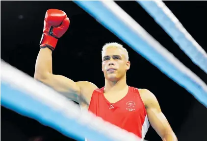  ?? Picture / Photosport ?? David Nyika salutes the crowd and judges after his first round fight at the Gold Coast Commonweal­th Games last night.