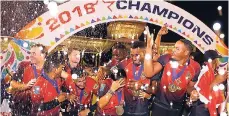  ?? FILE ?? Trinbago Knight Riders celebrate winning the championsh­ip during the Hero Caribbean Premier League Final between Trinbago Knight Riders and Guyana Amazon Warriors at the Brian Lara Stadium on September 16 in Tarouba, Trinidad and Tobago.