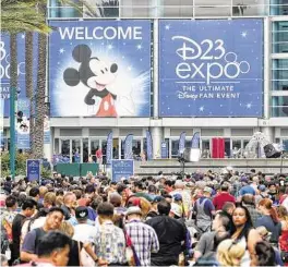  ?? Jeff Gritchen / Orange County Register ?? Members of Disney’s D23 fan club wait to enter the D23 Expo in Anaheim, Calif., in 2017. They were eligible to buy three years of Disney Plus service up front for the price of two years.