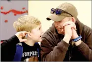  ?? LYNN KUTTER ENTERPRISE-LEADER ?? Dane Peacock and his son, Miles, 7, visit with each other during the All Pro Dad’s Day at Folsom Elementary School in Farmington. The next one will be Friday morning.