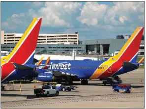  ?? (AP) ?? Southwest Airlines jets are shown last year at Love Field in Dallas. Airlines are anticipati­ng a significan­t rise in traffic at the airport in the coming months.