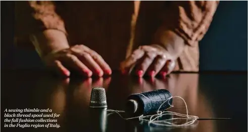  ??  ?? A sewing thimble and a black thread spool used for the fall fashion collection­s in the Puglia region of Italy.