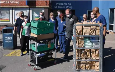  ??  ?? COMING TOGETHER: Nurses, staff and volunteers at Guy’s and St Thomas’ Hospital in London