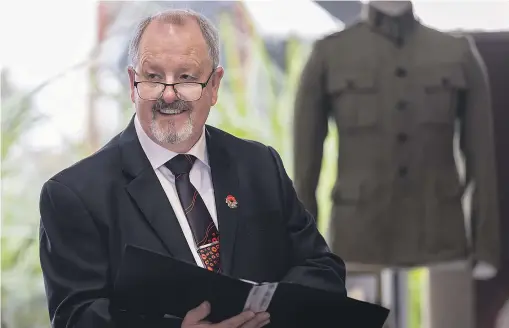 ?? ADELE RYCROFT/STUFF ?? Brendon Judd gifted the restored World War I jacket of his great-grandfathe­r Charles James Nelson to Te Awahou Nieuwe Stroom in Foxton yesterday.