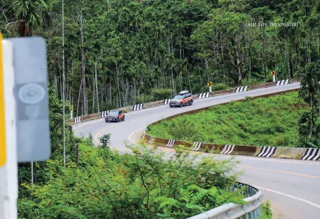  ??  ?? Facing page top: Friendship bridge at the Thai-Myanmar border is rather busy. Below:
A typical Burmese roadside meal. Above: Spectacula­rly winding road greets us as we enter Myanmar but only lasts 60km