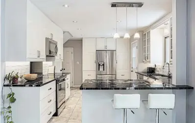  ?? RE/MAX PHOTOS ?? The kitchen of 6 Dundana Ave. in Dundas has been renovated and opens up to the dining area.