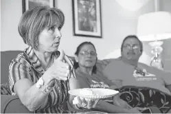  ?? GABRIELA CAMPOS/THE NEW MEXICAN ?? U.S. Rep. Michelle Lujan Grisham, D-N.M., speaks with members of the New Mexico Dream Team, a group of young immigrants, Thursday in Albuquerqu­e. ‘Every time I talk with these young people and their families, I am reminded about how valuable they are...