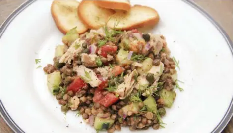  ?? MELISSA D’ARABIAN VIA ASSOCIATED PRESS ?? A lentil and salmon salad with smoky mustard dressing.