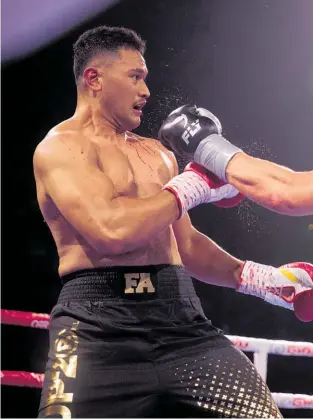  ??  ?? Junior Fa (left) proved durable against Joseph Parker last night.