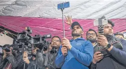  ??  ?? Reporters cover a protest against a new Indian citizenshi­p law in New Delhi on Feb 21, 2020.