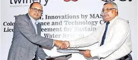  ??  ?? From left: MAS Holdings Chief Innovation Officer Ranil Vitarana exchanges signed licensing agreement with University of Colombo Science Faculty Dean Prof. K.R.R. Mahanama
