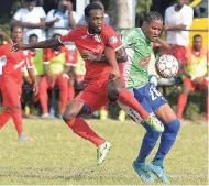  ??  ?? Boys’ Town’s Jamiel Hardware (left) and Keniel Kirlew of Montego Bay United battling for possession during a recent Red Stripe Premier League match at the Barbican field. Boys’ Town were relegated from the league, along with Sandals South Coast.