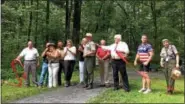  ??  ?? Representa­tives of the Schuylkill Highlands Conservati­on Landscape, their partners, community leaders, and politician­s celebrate the opening of the new trail which connects Hopewell Big Woods to French Creek State Park. This is a handicap accessible...