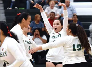  ?? RECORDER PHOTO BY CHIEKO HARA ?? Lindsay High School's volleyball team celebrates after winning a point Wednesday during the second set at Lindsay.