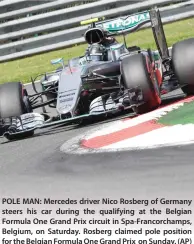  ??  ?? POLE MAN: Mercedes driver Nico Rosberg of Germany steers his car during the qualifying at the Belgian Formula One Grand Prix circuit in Spa-Francorcha­mps, Belgium, on Saturday. Rosberg claimed pole position for the Belgian Formula One Grand Prix on...