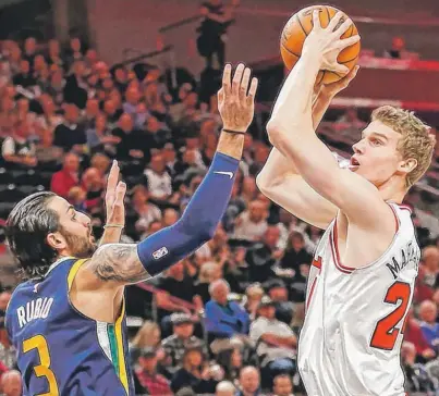  ??  ?? Lauri Markkanen, shooting over Jazz guard Ricky Rubio, struggled with his shot against Utah and the Lakers. | RICK BOWMER/ AP