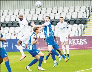  ??  ?? HEADS UP: Jamal Fyfield glances home Boreham Wood’s opening goal