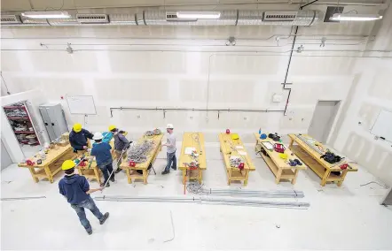  ?? QC PHOTO BY BRANDON HARDER ?? An overhead view of one half of the electrical workshop at the Regina Trades and Skills Centre in Regina.