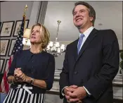  ?? GETTY IMAGES ?? Sen. Shelley Moore Capito, R-W.V., greets Judge Brett Kavanaugh prior to a meeting last week. Kavanaugh met with senators after President Donald Trump nominated him to succeed retiring Supreme Court Associate Justice Anthony Kennedy.