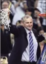  ?? Andy Lyons / Getty Images ?? UConn coach Jim Calhoun cuts down the net after defeating Butler to win the NCAA national championsh­ip game in 2011.