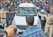  ??  ?? Police make way for a vehicle carrying three people suspected of steering the fraudulent loans, in Mumbai. REUTERS PHOTO