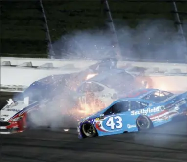  ?? COLIN E. BRALEY — THE ASSOCIATED PRESS ?? Aric Almirola (43) crashes into Danica Patrick, center, and Joey Logano, left, during the NASCAR Monster Cup auto race at Kansas Speedway in Kansas City, Kan. on Saturday.