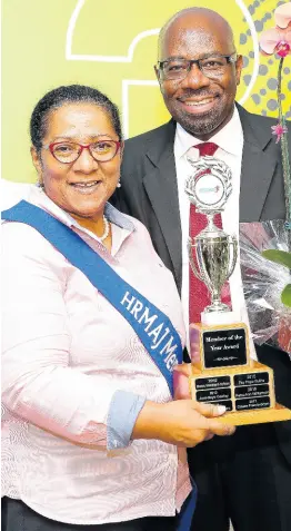  ?? CONTRIBUTE­D ?? Karl Williams, president of the Human Resource Management Associatio­n of Jamaica, shares lens time with 2018 Member of the Year, Genieve Sundar.