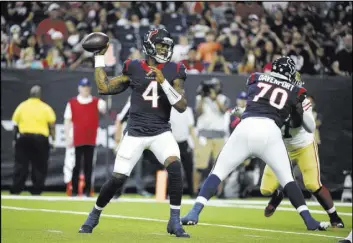  ?? Eric Christian Smith The Associated Press ?? Texans quarterbac­k Deshaun Watson prepares to pass in the first quarter of Houston’s 16-13 win over the 49ers. He finished 5 of 8 for 73 yards and a touchdown.