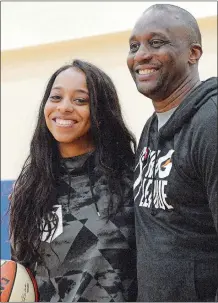  ?? DANA JENSEN/THE DAY ?? Lexi Brown, Connecticu­t’s top draft pick out of Duke, and her father, Dee Brown, a former NBA player and WNBA coach, pose for a photo after taking part in a press conference on Friday at the Mohegan Sun Community Center.