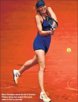  ??  ?? Maria Sharapova returns the ball to Karolina Pliskova during their singles third round match in Paris on Saturday.