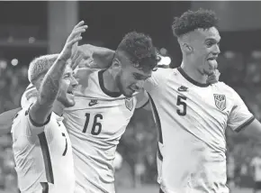  ?? CHUCK BURTON/USA TODAY SPORTS ?? United States forward Ricardo Pepi (15) leads the team with three goals in this round of World Cup qualifying. Here he celebrates scoring against Jamaica with teammates Paul Arriola (7) and Antonee Robinson (5).