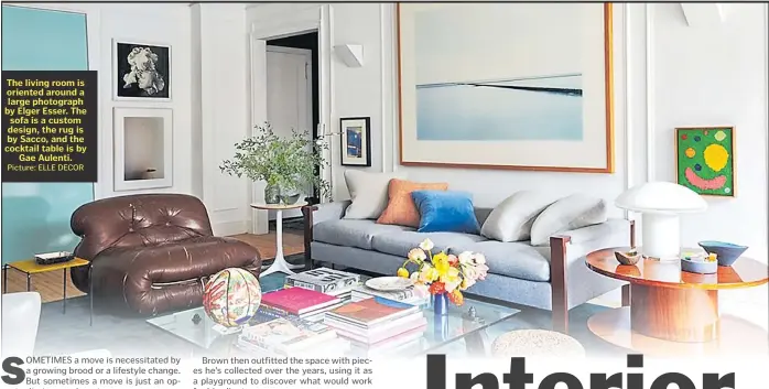  ?? Picture: ELLE DECOR ?? The living room is oriented around a large photograph by Elger Esser. The sofa is a custom design, the rug is by Sacco, and the cocktail table is by Gae Aulenti.