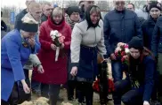  ?? — AFP ?? People attend the funeral of metro blast vicitm Irina Medyantsev­a in Leningrad, Russia, on Thursday.