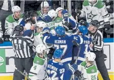  ?? Jason Franson, The Canadian Press ?? Dallas Stars and Tampa Bay Lightning players rough it up during Saturday’s first- period of Game 1 of the Stanley Cup Final in Edmonton, Alberta.