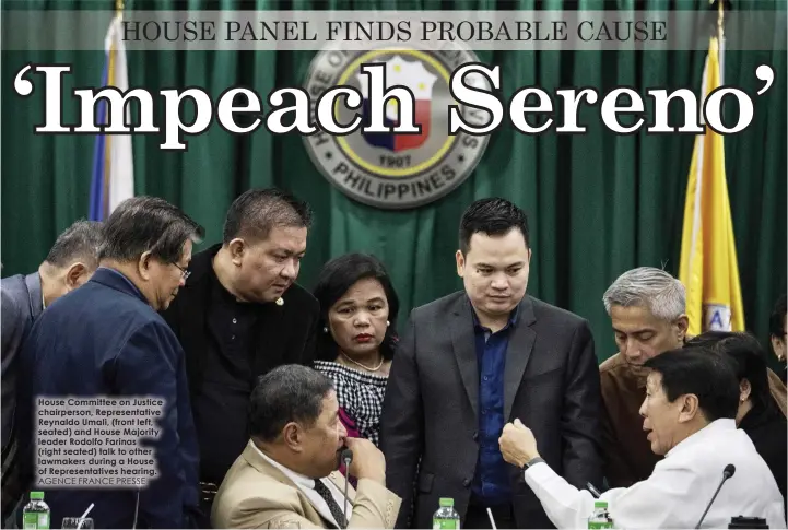  ?? AGENCE FRANCE PRESSE ?? House Committee on Justice chairperso­n, Representa­tive Reynaldo Umali, (front left, seated) and House Majority leader Rodolfo Farinas (right seated) talk to other lawmakers during a House of Representa­tives hearing.