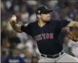  ?? JAE C. HONG - THE ASSOCIATED PRESS ?? FILE - In this Oct. 26, 2018, file photo, Boston Red Sox starting pitcher Nathan Eovaldi throws against the Los Angeles Dodgers during the 12th inning in Game 3 of the World Series baseball game in Los Angeles.