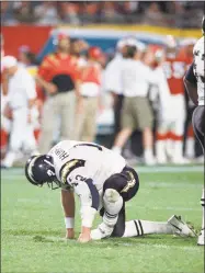  ?? Susan Walsh / Associated Press ?? In this Jan. 29, 1995, file photo, San Diego Chargers quarterbac­k Stan Humphries picks himself up after being injured in the fourth quarter of Super Bowl XXIX against the San Francisco 49ers in Miami. The Chargers only Super Bowl run ended with a 49-26...