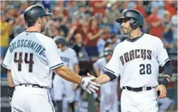  ?? DAVID KADLUBOWSK­I THE ARIZONA REPUBLIC, VIA USA TODAY NETWORK ?? Paul Goldschmid­t and J.D. Martinez have Arizona on the verge of the postseason.