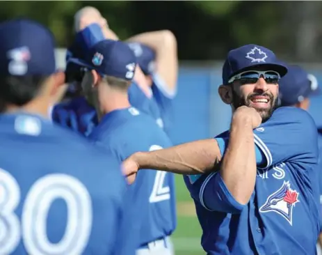  ?? STEVE RUSSELL/TORONTO STAR ?? The Jays’ Jose Bautista limbers up during an informal spring training workout Monday with his teammates at the Englebert Complex in Dunedin.