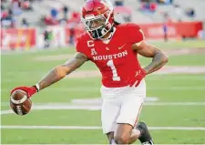  ?? ?? While undersized, UH receiver Nathaniel “Tank” Dell was in the top two in the country in most major receiving categories.