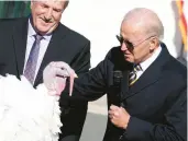  ?? YURI GRIPAS/ABACA PRESS ?? President Biden pardons a Thanksgivi­ng turkey Monday on the South Lawn of the White House.