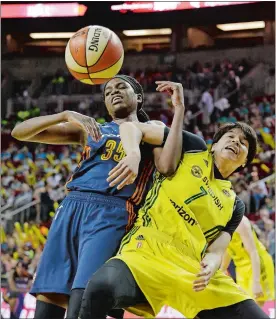  ?? ELAINE THOMPSON/AP PHOTO ?? Jonquel Jones of the Connecticu­t Sun, left, and Ramu Tokashiki of the Seattle Storm become entangled following a first-half free throw Wednesday in Seattle.