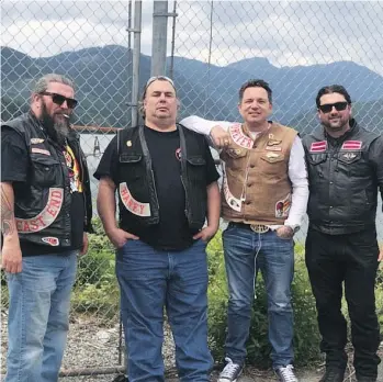  ??  ?? Burnaby firefighte­r Nick Elmes, far right, a founder of Florian’s Knights, poses with Hells Angels Kelowna president Damiano Dipopolo, beside him, and two other Hells Angels. Elmes says there is no reason to be concerned.