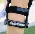  ?? CHARLES TRAINOR JR/MIAMI HERALD ?? Miami Dolphins quarterbac­k Ryan Tannehill’s new leg brace.